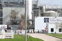 Tyson's Fresh Meat workers file in for a tour of safety measures put into place after the plant in Waterloo, Iowa, had to shut down due to a COVID-19 outbreak, May 2020.