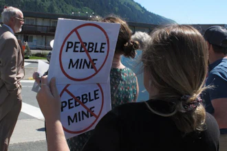 People gathered outside U.S. Sen. Lisa Murkowski's office in Juneau, Alaska, to protest the proposed Pebble Mine, June 25, 2019.