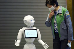 Humanoid robot Pepper greets Gov. Yuriko Koike in Tokyo, May 1, 2020.