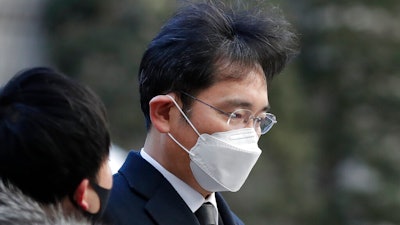 Samsung Electronics Vice Chairman Lee Jae-yong is questioned by a reporter upon arrival at the Seoul High Court in Seoul, South Korea, Dec. 30, 2020.