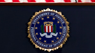The FBI seal seen before a news conference at FBI headquarters in Washington, June 14, 2018.