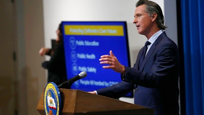 California Gov. Gavin Newsom discusses his revised 2020-2021 state budget during a news conference in Sacramento, May 14, 2020.