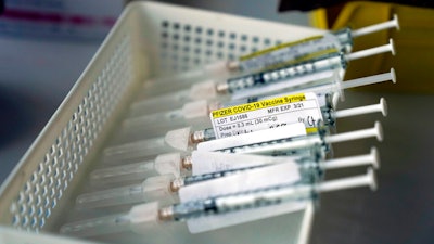 Syringes containing the Pfizer-BioNTech COVID-19 vaccine at St. Joseph Hospital in Orange, Calif., Jan. 7, 2021.