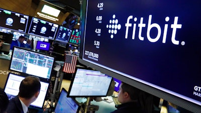 Fitbit logo above a trading post at the New York Stock Exchange, Oct. 28, 2019.