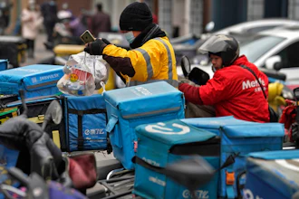 A food delivery worker outside a restaurant in Beijing, Jan. 14, 2021.