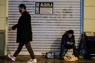A homeless with his dog in Pamplona, Spain, Jan. 21, 2021.