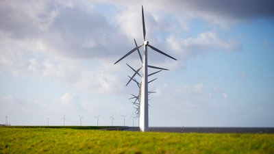 Wind turbines on a dike near Urk, Netherlands, Jan. 22, 2021.