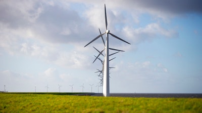 Wind turbines on a dike near Urk, Netherlands, Jan. 22, 2021.