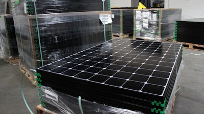 SunPower solar panels stacked in Positive Energy Solar's warehouse, Albuquerque, N.M., March 9, 2016.