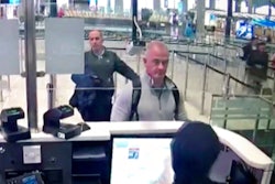 Image from security camera video showing Michael L. Taylor, center, and George-Antoine Zayek at passport control, Istanbul Airport, Dec. 30, 2019.
