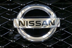 This Feb. 14, 2013 file photo shows the Nissan logo on the grill of a 2013 Nissan Pathfinder on display at the 2013 Pittsburgh Auto Show in Pittsburgh. Nissan is recalling over 354,000 Pathfinder SUVs worldwide because the brake lights can stay on all the time. It's the second recall for the same problem. The recall covers certain Pathfinders from the 2013 through 2015 model years.