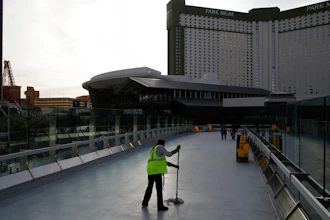 A worker cleans along the Las Vegas Strip, March 31, 2020.