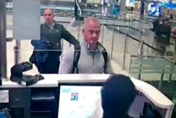 Image from security camera video showing Michael L. Taylor, center, and George-Antoine Zayek at passport control at Istanbul Airport, Dec. 30, 2019.
