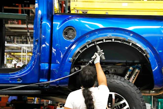 An assemblyman works on a 2018 Ford F-150 truck at the Ford Rouge assembly plant, Dearborn, Mich., Sept. 27, 2018.