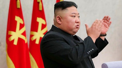 In this photo provided by the North Korean government, North Korean leader Kim Jong Un at a meeting of the Central Committee of the Worker’s Party of Korea, Pyongyang, Feb. 8, 2021. Independent journalists were not given access to cover the event depicted; content is as provided and cannot be independently verified.