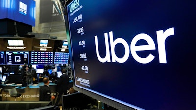 Uber logo above a trading post at the New York Stock Exchange, May 30, 2019.