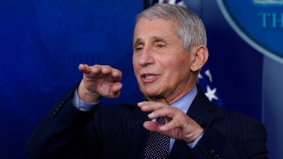 Dr. Anthony Fauci, director of the National Institute of Allergy and Infectious Diseases, speaks with reporters at the White House, Jan. 21, 2021.