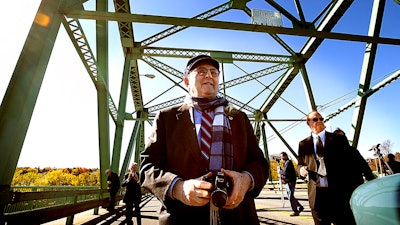 Dr. Bernard Lown walks on the bridge renamed in his honor in Lewiston, Maine, Oct. 17, 2008.