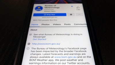 A disclaimer shown on the bottom of Australia's Bureau of Meteorology page on the Facebook app, Feb. 18, 2021, Tokyo.