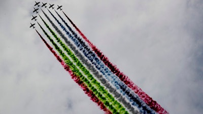 Al Fursan, or the Knights, a UAE Air Force aerobatic display team, perform during the opening day of the International Defence Exhibition & Conference, IDEX, in Abu Dhabi, Feb. 21, 2021.