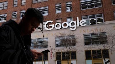 A man walks past Google's offices in New York, Dec. 17, 2018.