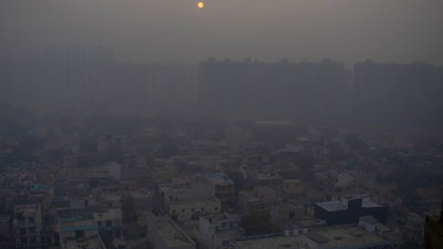 The morning sun seen through a blanket of smog outside New Delhi, India, Jan. 2, 2021.