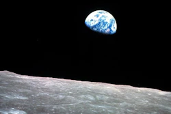 The Earth behind the surface of the moon during the Apollo 8 mission, Dec. 24, 1968.