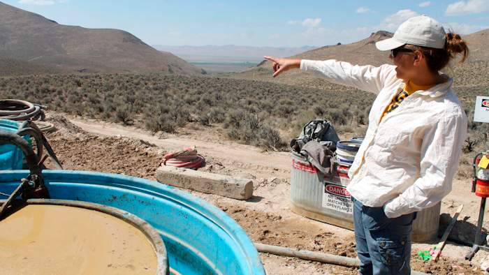 Melissa Boerst, a Lithium Nevada Corp. geologist, points to an area of future exploration from a drill site at the Thacker Pass Project, Humboldt County, Nev., Sept. 13, 2018.