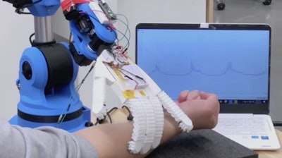 The robotic arm monitoring electrical signals.