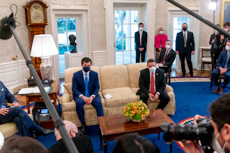 From left, President Joe Biden, Transportation Secretary Pete Buttigieg, House Transportation and Infrastructure Committee Ranking Member Rep. Sam Graves, R-Mo., Rep. Brian Fitzpatrick, R-Pa., Highways and Transit Subcommittee Ranking Member Rep. Rodney Davis, R-Ill., and other members of the House of Representatives meet in the Oval Office, March 4, 2021.
