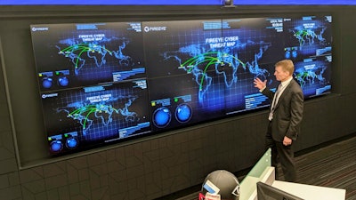 FireEye CEO Kevin Mandia gives a tour of the cybersecurity company's office in Reston, Va., March 9, 2021.