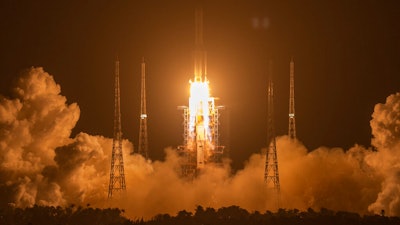 A Long March-5 rocket carrying the Chang'e 5 lunar mission lifts off at the Wenchang Space Launch Center, Nov. 24, 2020.