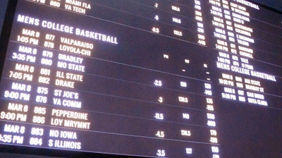 A betting board lists the odds on college basketball games at the Tropicana casino, Atlantic City, N.J., March 8, 2019.