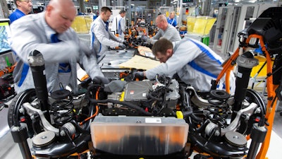 Workers complete a Volkswagen ID.3 body on the assembly line in Zwickau, Germany, Feb. 25, 2020.