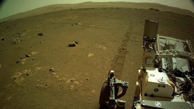 Tire tracks left by the Mars Perseverance rover, Mar. 7, 2021.