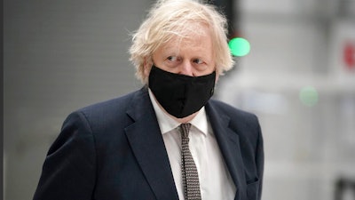 British Prime Minister Boris Johnson during a visit to BAE Systems at Warton Aerodrome, Lancashire, England, March 22, 2021.