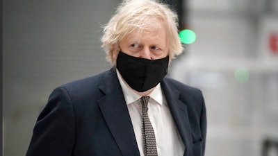 British Prime Minister Boris Johnson during a visit to BAE Systems at Warton Aerodrome, Lancashire, England, March 22, 2021.