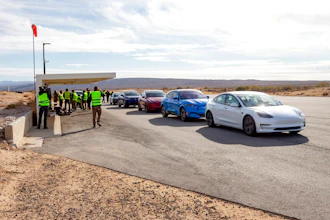 Five electric vehicles at a test track in California's Mojave Desert.
