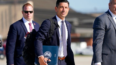 Then acting-Secretary of Homeland Security Chad Wolf, center, at Andrews Air Force Base in Md., Aug. 18, 2020.