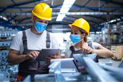 Industrial Workers With Face Masks Protected Against Corona Virus Discussing About Production In Factory People Working During Covid 19 Pandemic 1277323829 2125x1416