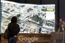 Sean Askay, right, engineering manager with Google Earth, demonstrates its features in New York, April 18, 2017.