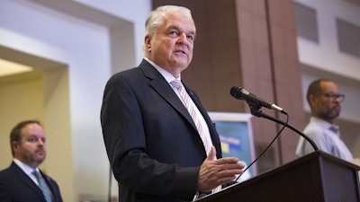Nevada Gov. Steve Sisolak discusses at the Grant Sawyer Building in Las Vegas, March 29, 2020.