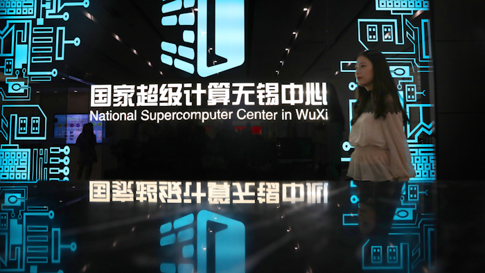 A woman walks in the hallway of the National Supercomputer Center in Wuxi, which hosts the Shenwei (Sunway) TaihuLight supercomputer.