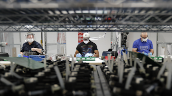 Ford Motor Co. line workers put together ventilators at the Ford Rawsonville plant, Ypsilanti Township, Mich., May 13, 2020.