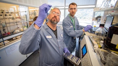 Brett Helms, foreground, in the Molecular Foundry in 2019.