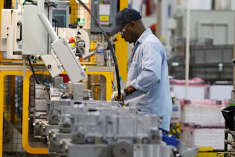 An autoworker assembles a transmission at the General Motors Transmission Plant in Toledo, Ohio.