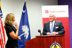 Benedict College President Roslyn Clark Artis and South Carolina Gov. Henry McMaster at a news conference in Columbia, March 30, 2021.