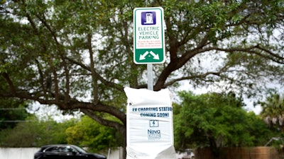 A parking area with charging stations for electric vehicles at a public park in Orlando, Fla., April 1, 2021.