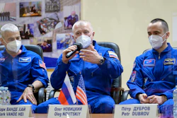 From left, U.S. astronaut Mark Vande Hei and Russian cosmonauts Oleg Novitsky and Pyotr Dubrov attend a news conference in the Baikonur Cosmodrome, Kazakhstan, April 8, 2021.