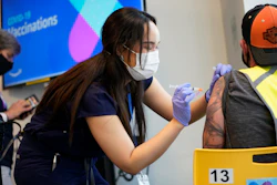 Registered nurse Sofia Mercado administers a vaccine at an Amazon Fulfillment Center, North Las Vegas, Nev., March 31, 2021.